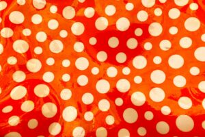 red and white polka dot textile